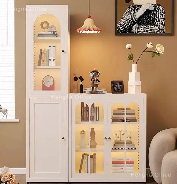 Modern double-door bookcase with fluted glass doors in a minimalist office space.